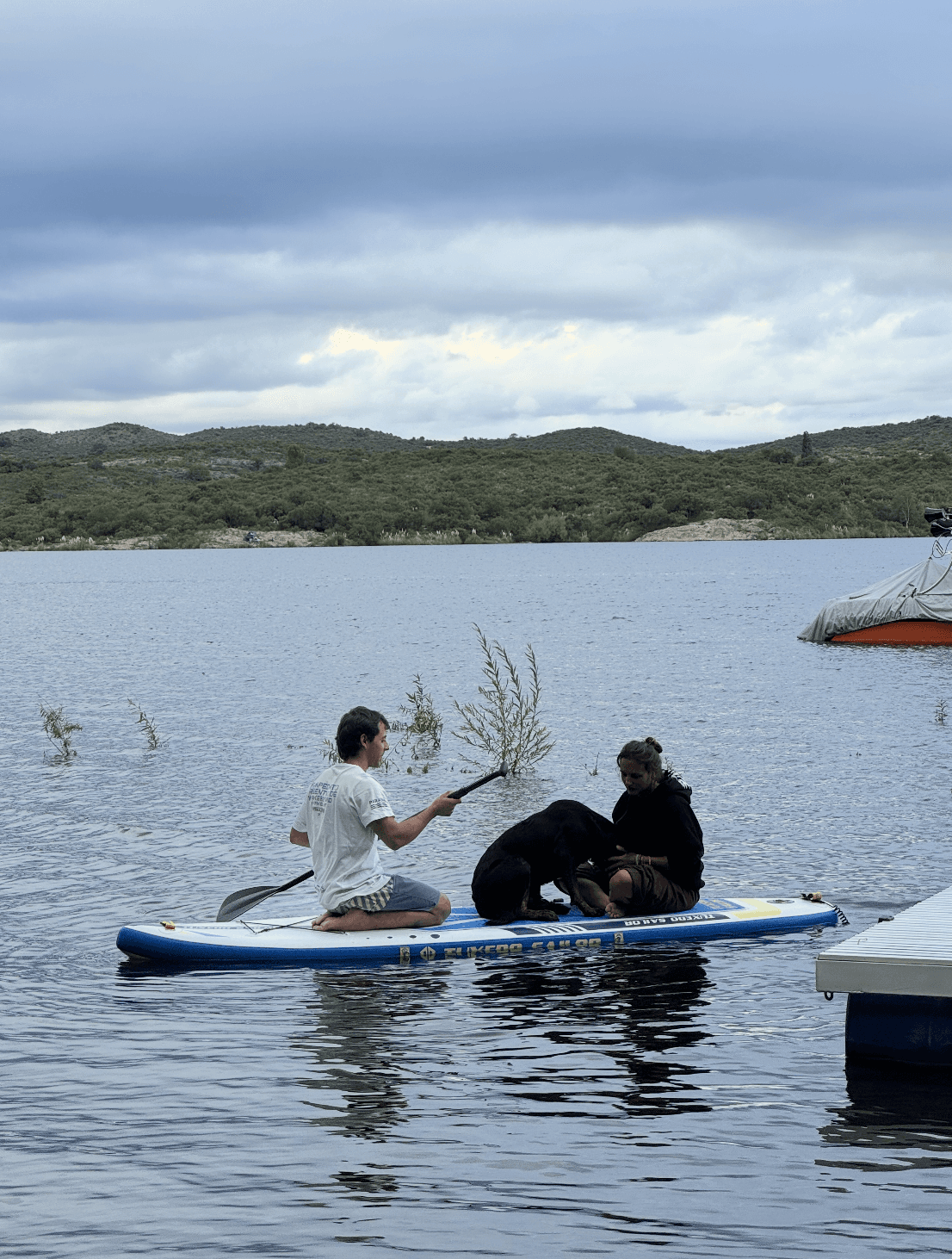 Stand-up paddleboarding on the calm lake