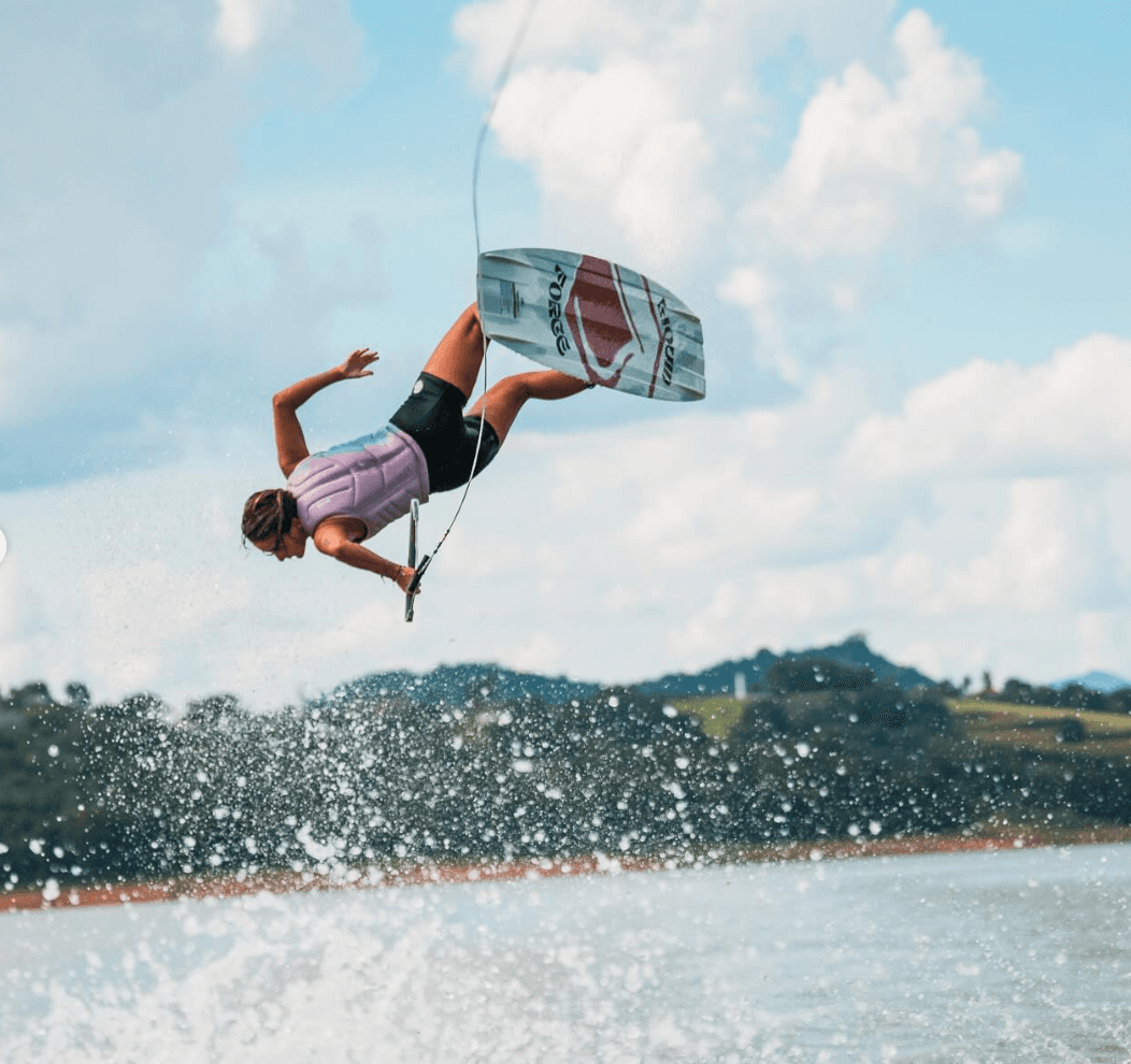Wakeboarder throwing an inverted air trick over the lake at Wakespot Club